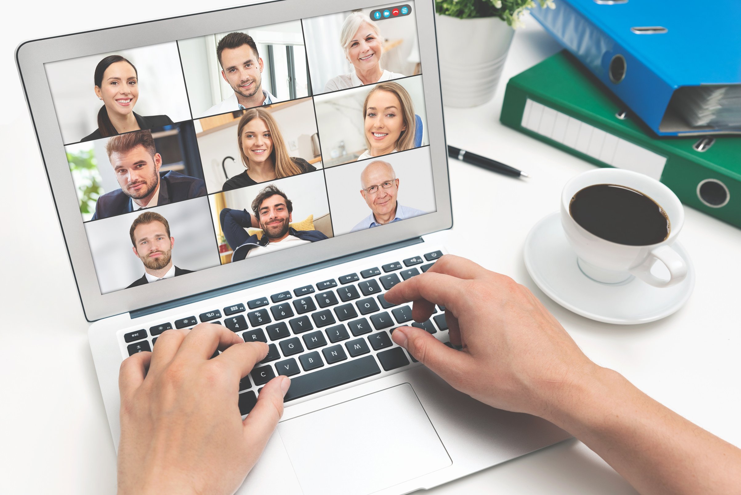 Video Conference with Multiple Employees on Laptop